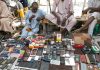 Street vendors display used mobile phone handsets for sale at Jagwal Electronics Market in Maiduguri, Nigeria.